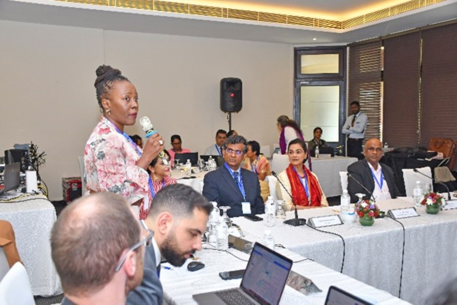 Group involved in discussions during the hybrid workshop