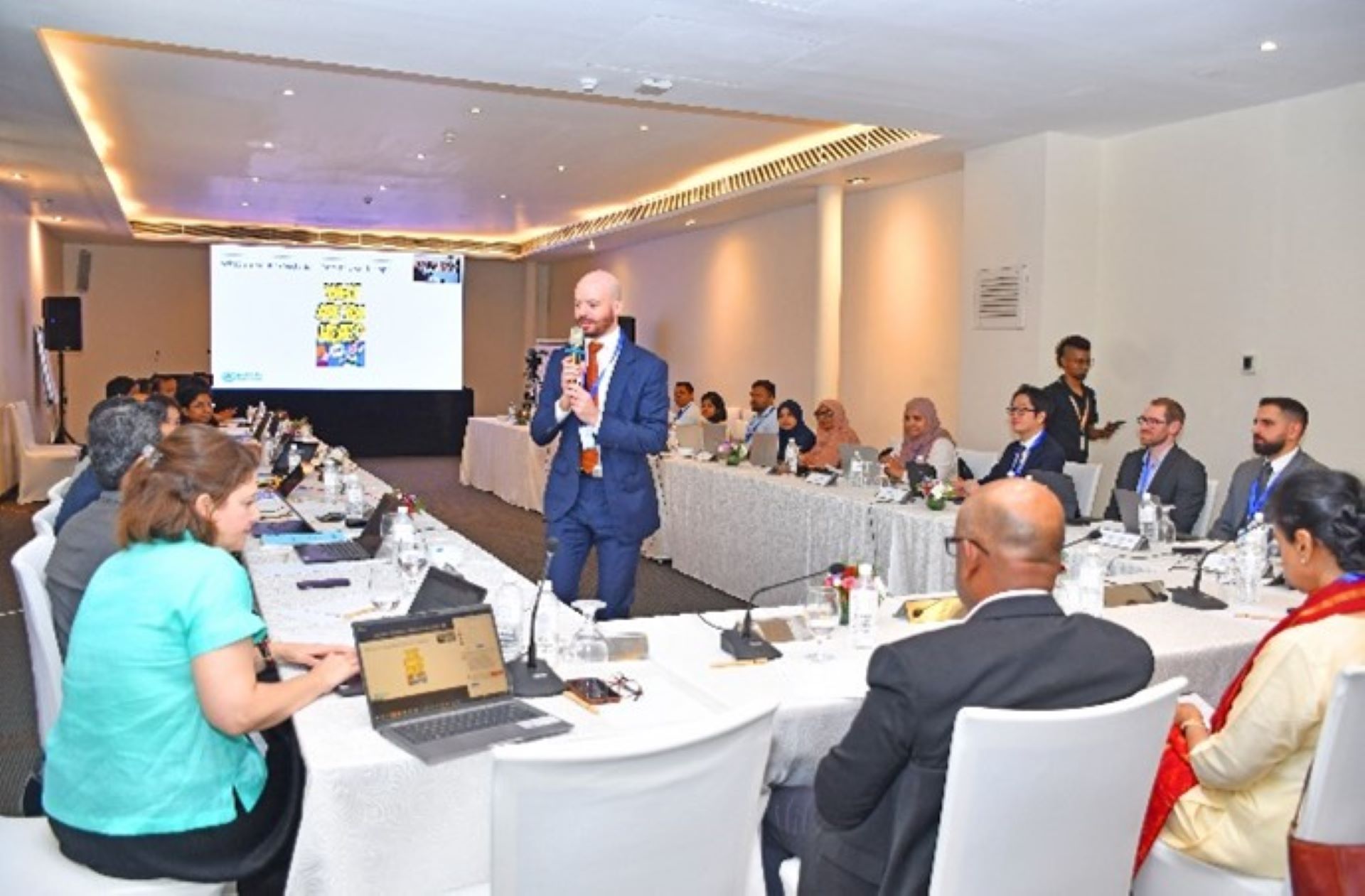 Group involved in discussions during the hybrid workshop
