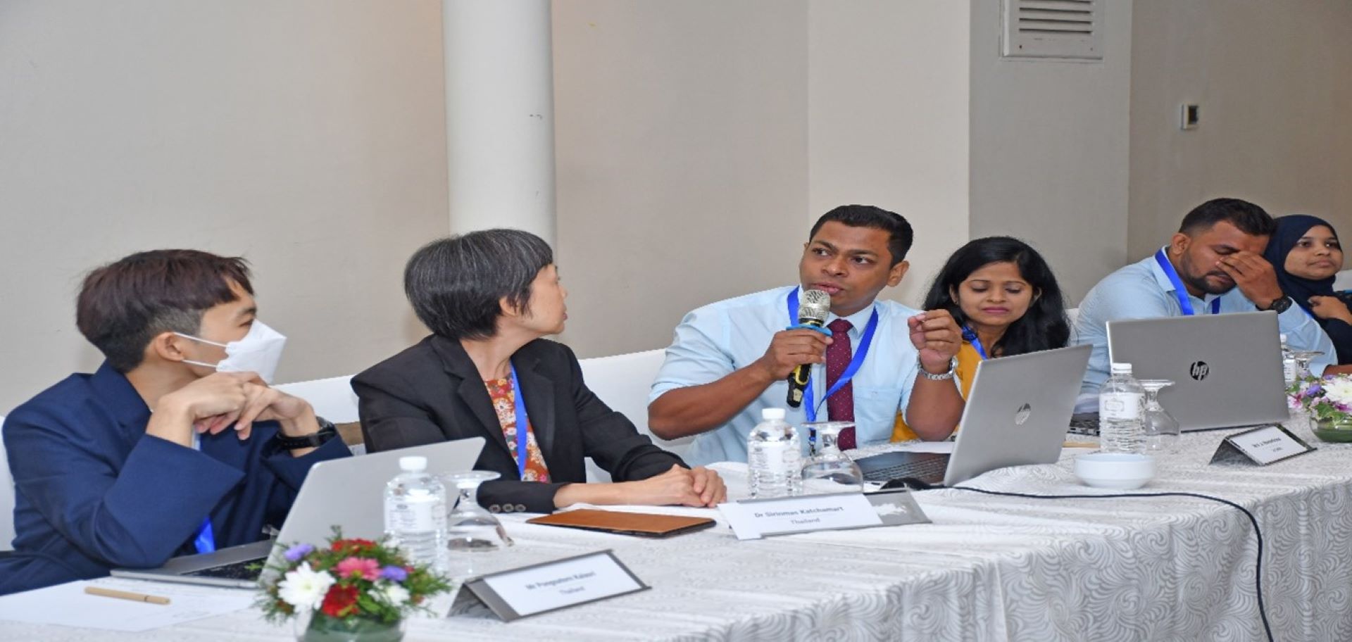 Group involved in discussions during the hybrid workshop