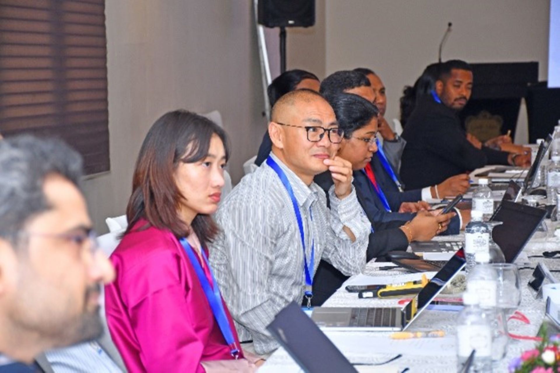 Group involved in discussions during the hybrid workshop