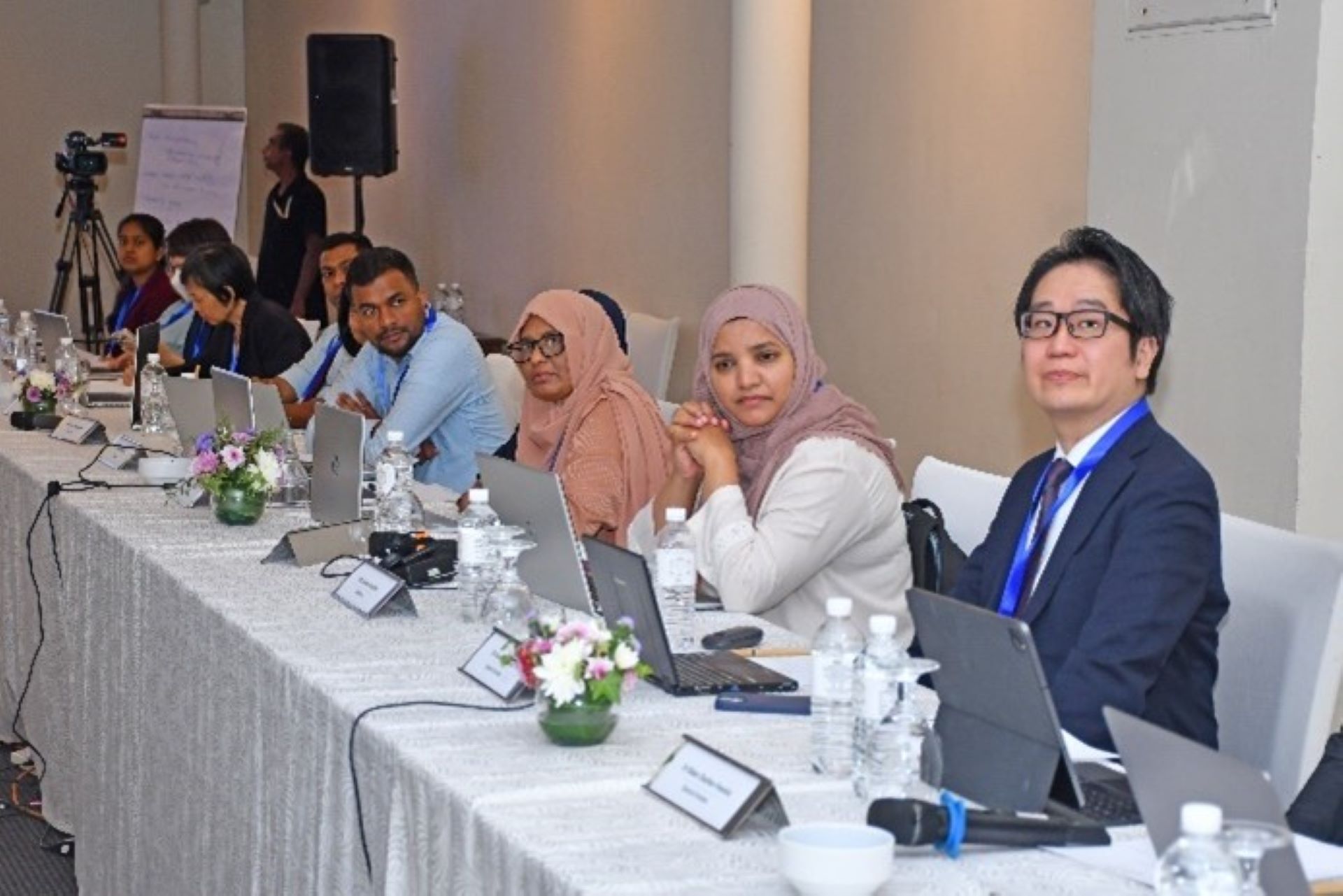 Group involved in discussions during the hybrid workshop