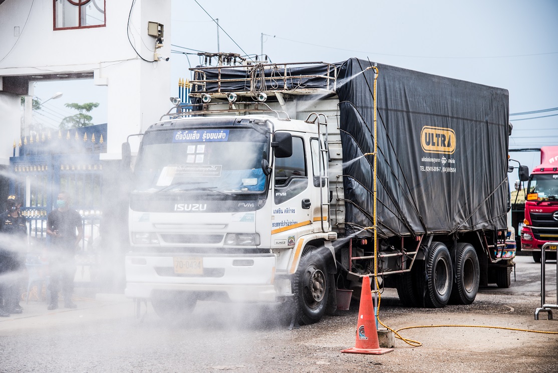 A Thai truck carrying goods is sprayed with novel coronavirus-killing disinfectant while entering Cambodia after crossing Thailand’s Baan Laem border checkpoint on 29 May 2020