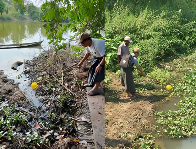 Two men collecting water samples on the banks of a river