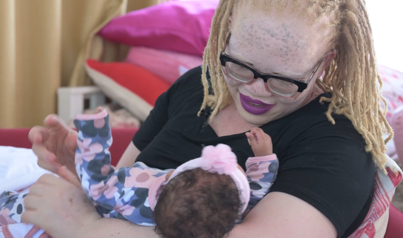 Jane with a baby in her arms