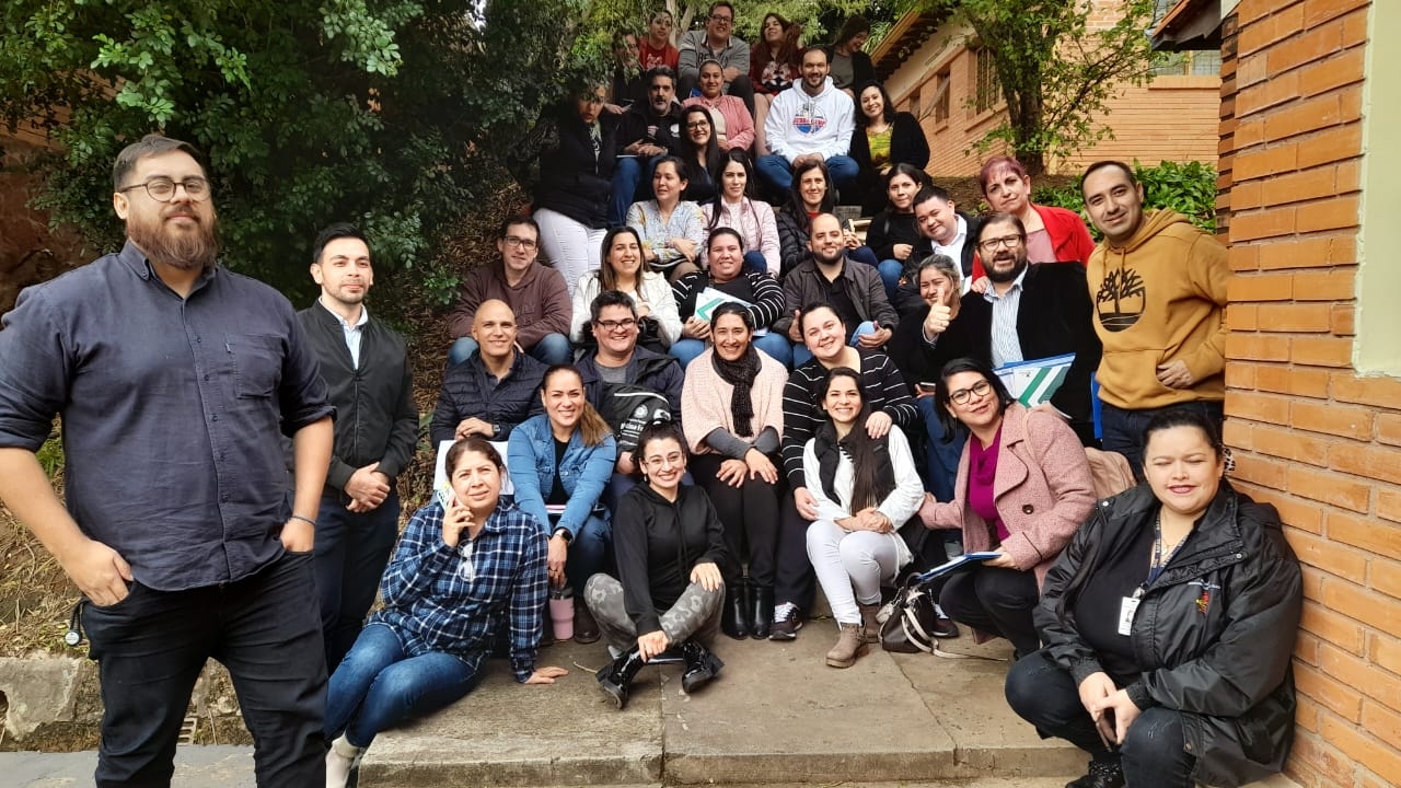 Mental Health Gap Action Programme training Paraguay People gathered together for a group photo outside a building.