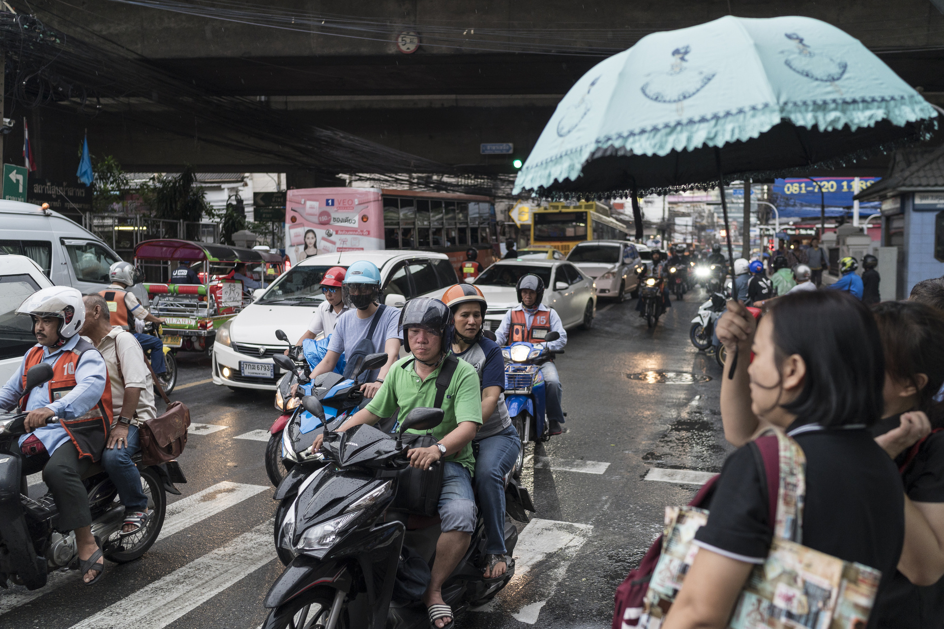 A busy road with motorbikes and cars