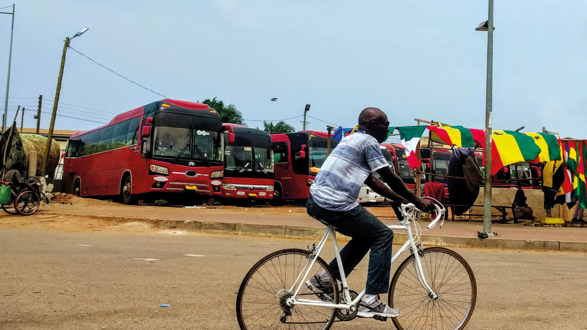 Man cycling in Accra street