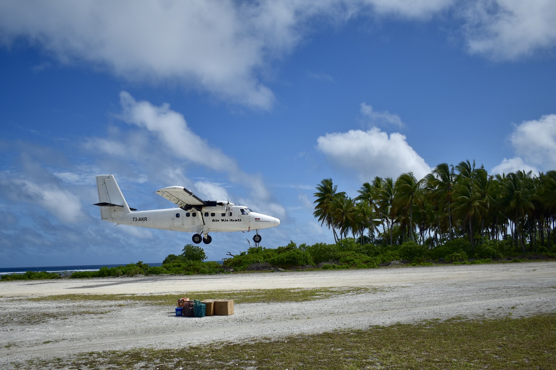 A small airplane about to land on an island