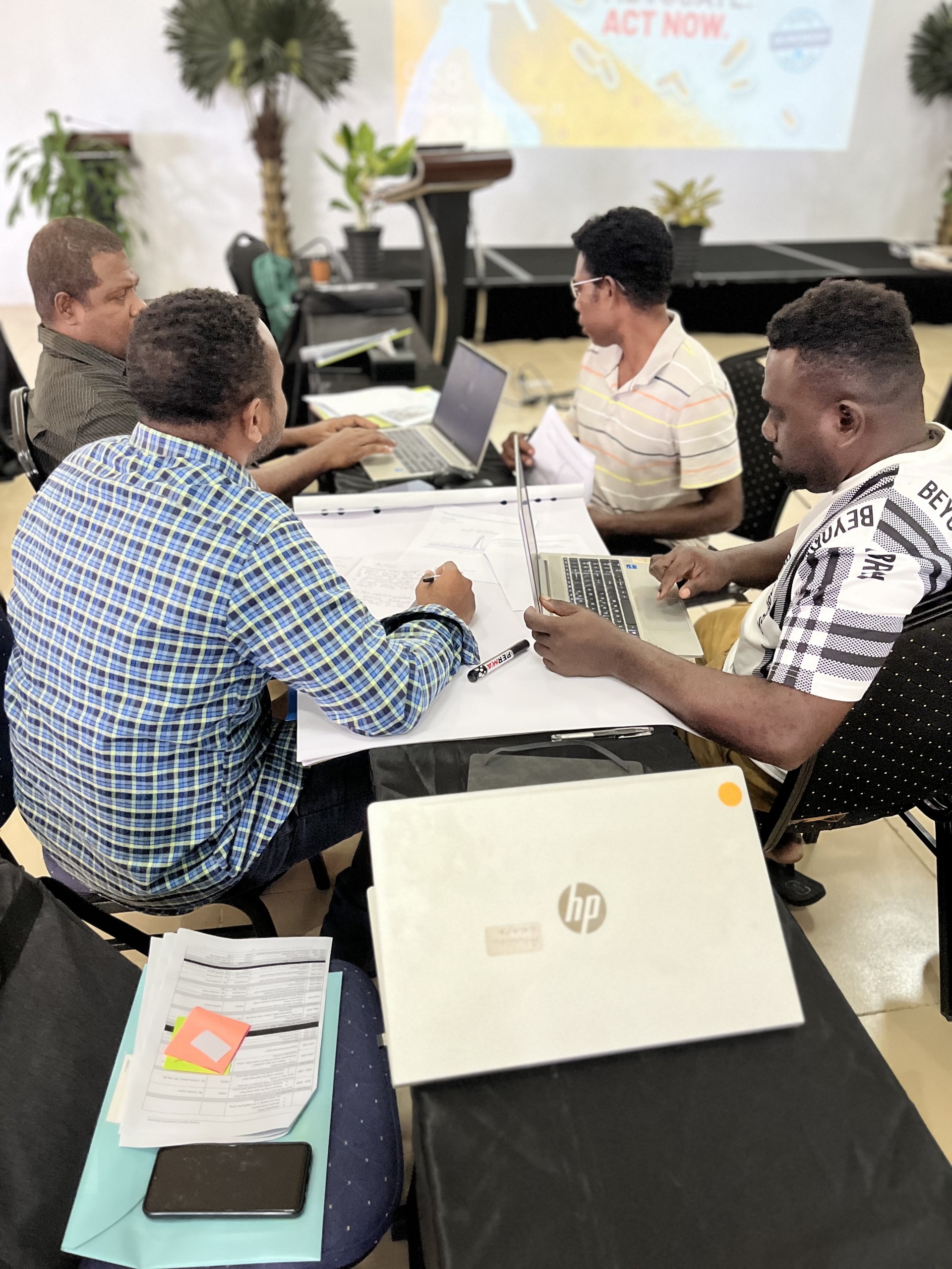 Four participants sitting around a table during a workforce training session