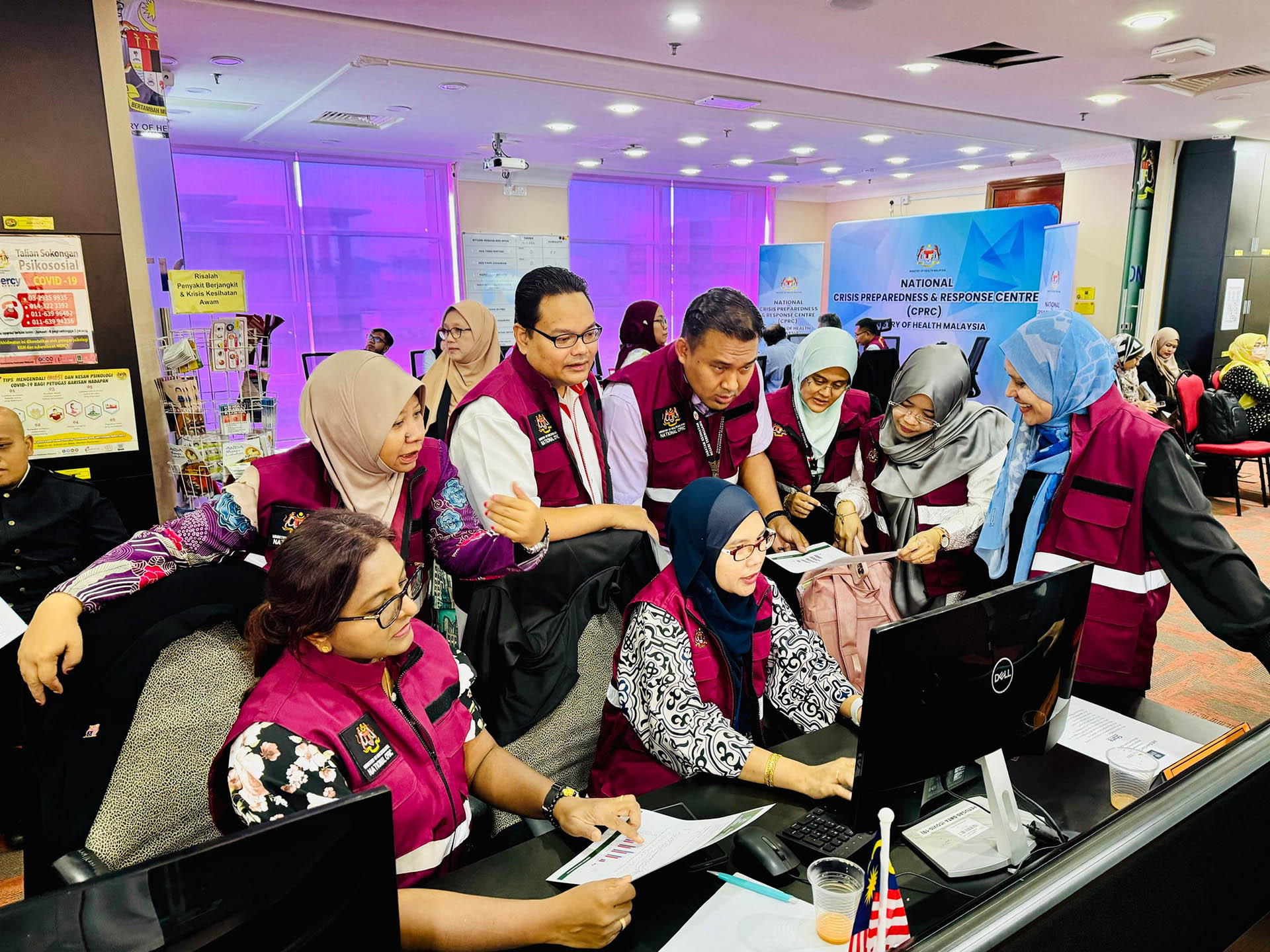 Members of Malaysia's National Crisis Preparedness and Response Centre at the Ministry of Health, participate in a IHR simulation exercise.