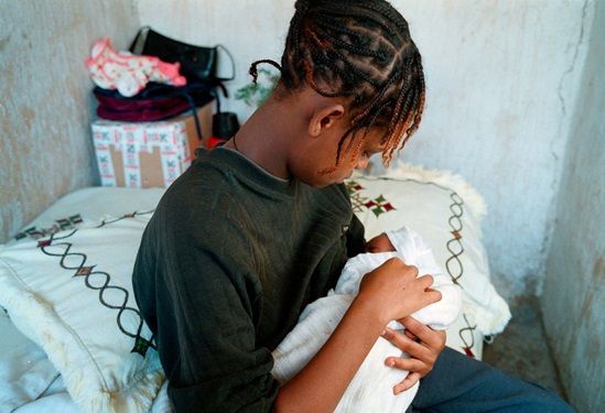 Somalia 2022: A mother holds her malnourished 1-year old daughter, in a hospital
