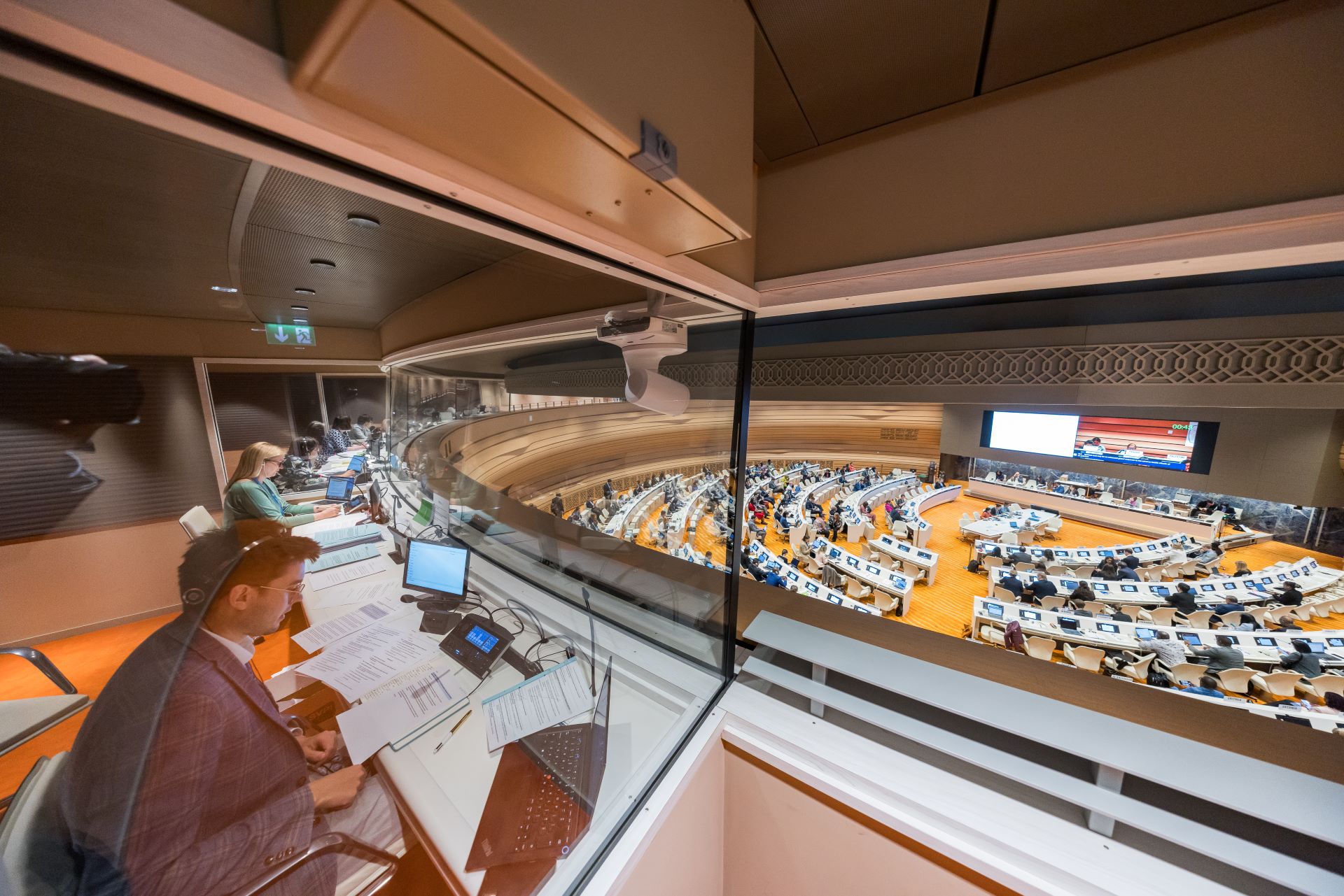 Interpreters' booths overlooking a large meeting room