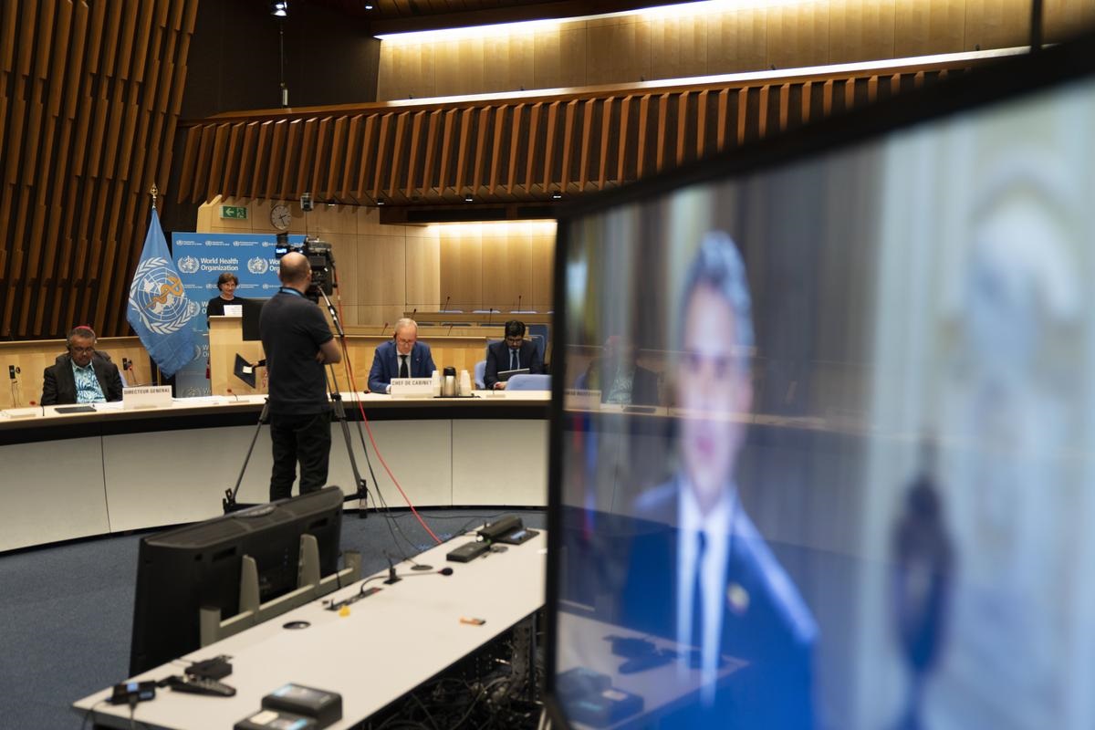 Behind the scenes, Executive Board Room in WHO Headquarters, Geneva Behind the scenes during the Seventy-third World Health Assembly, tv monitor and cameraman