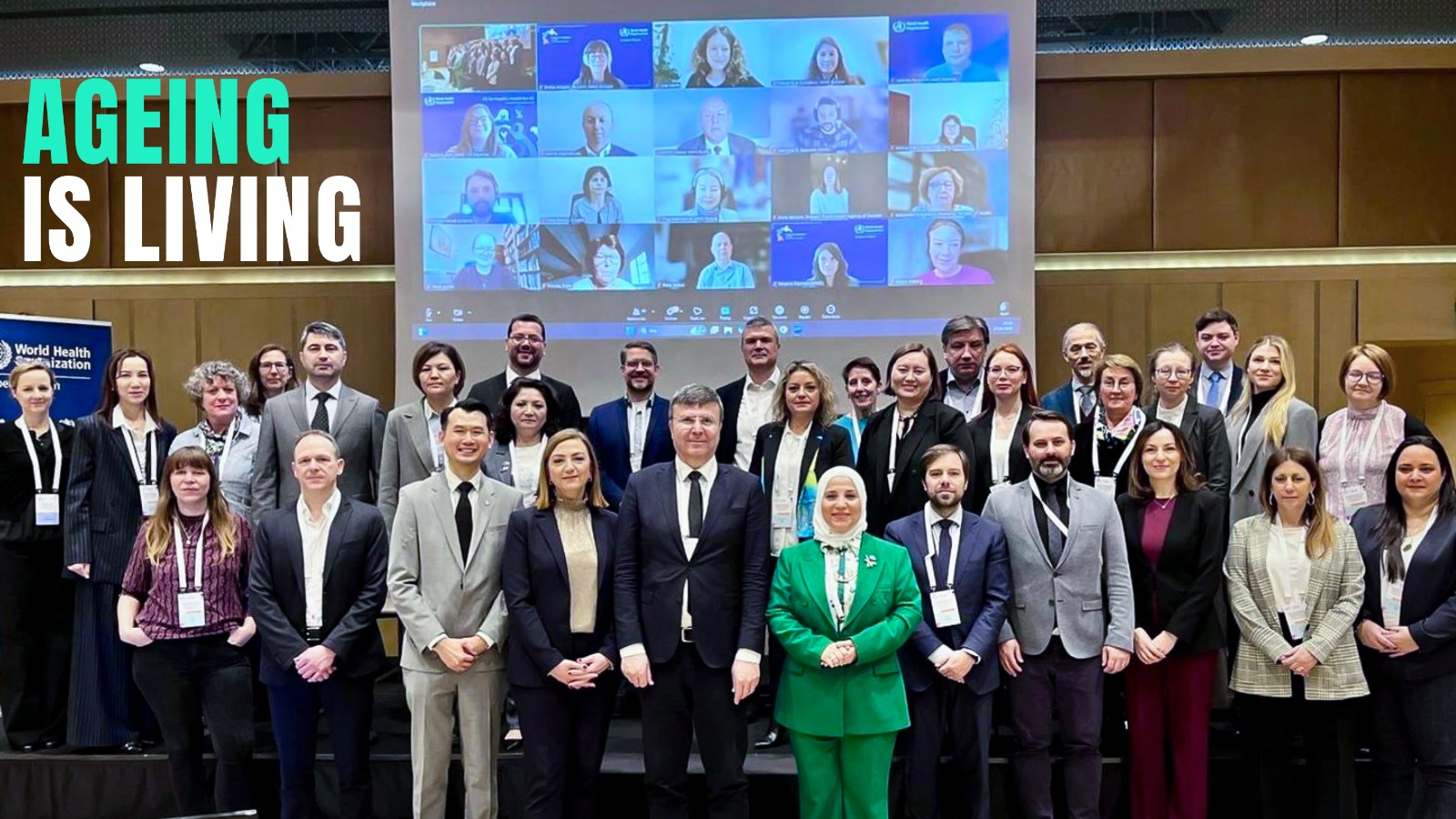 Participants posing for a group photo in the meeting room
