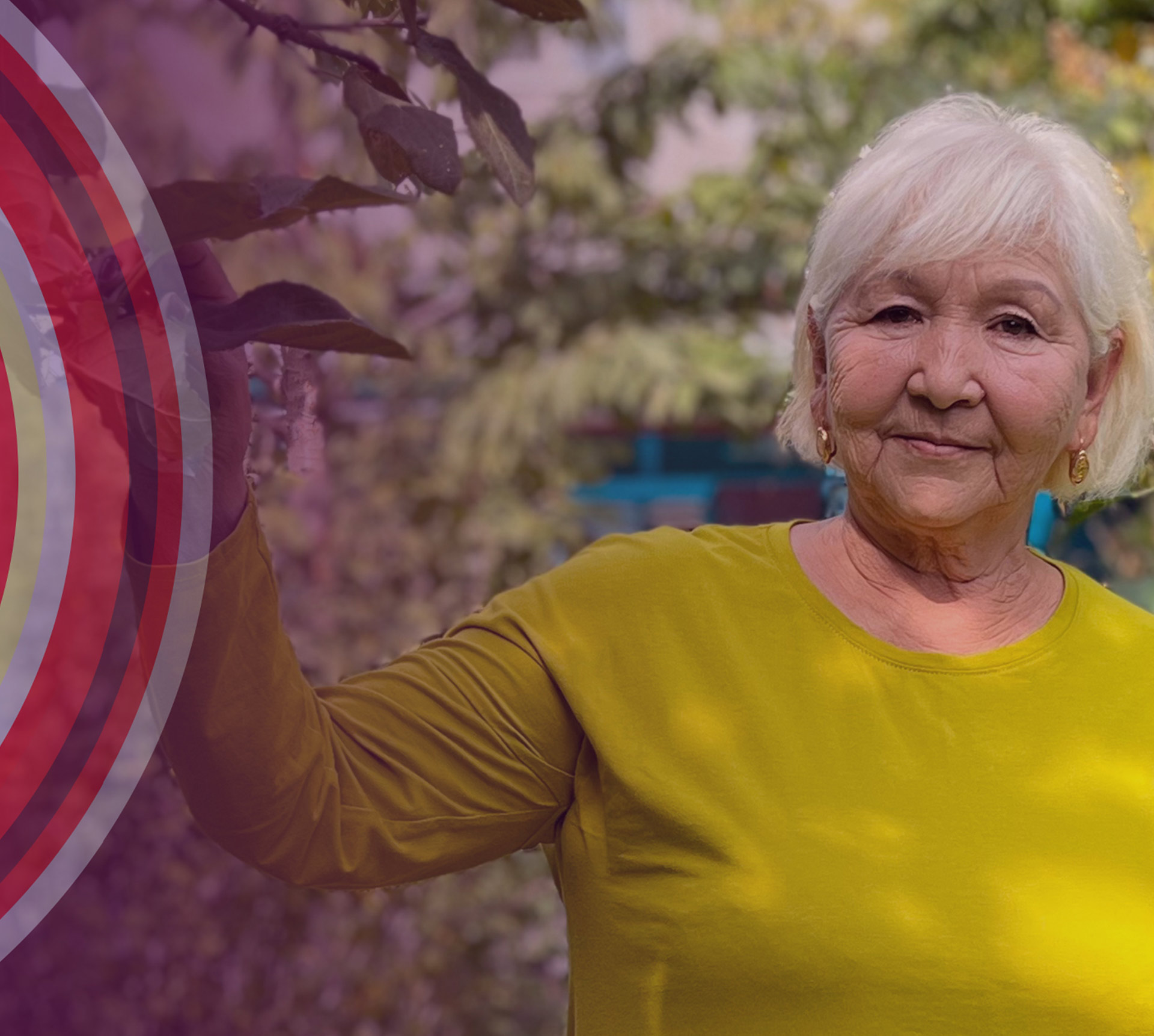 Lady standing in a garden, with a stylized graphic of a target superimposed on the left-hand side of the image, to her right.