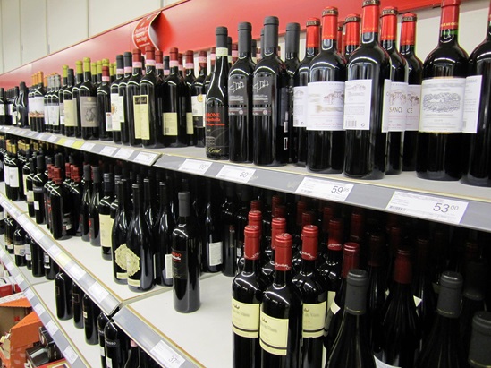 Wine bottles displayed on a supermarket shelf